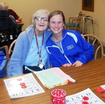 Student volunteers bring smiles to residents at Light of Hearts Villa
