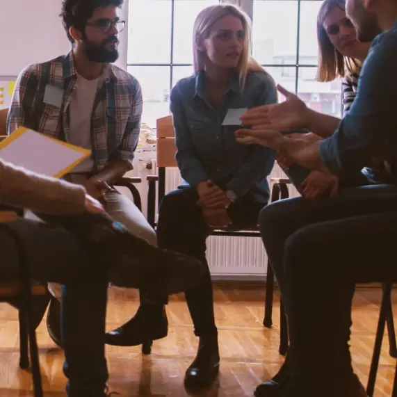 group of people sitting and talking